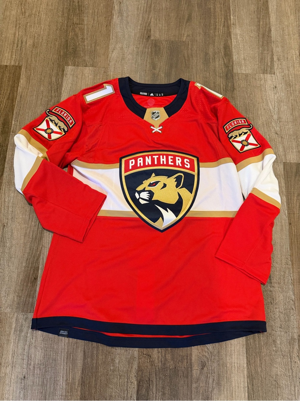Adidas NHL Florida Panthers “Huberdeau” Jersey.
- Size 52 Men.